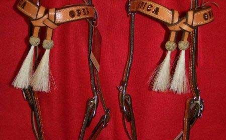 Matching set of headstalls crossed browband with horse hair tassles and rawhide braiding