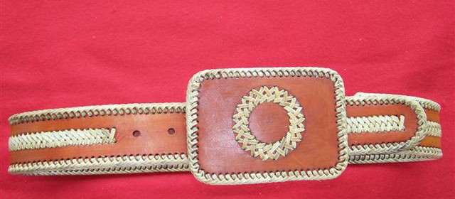 Belt with rawhide lace and accents