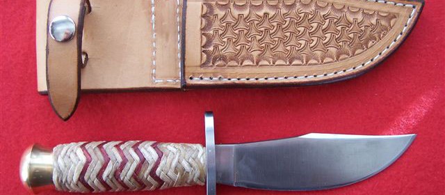 Hunting knife, solingen steel blade with rawhide handle
