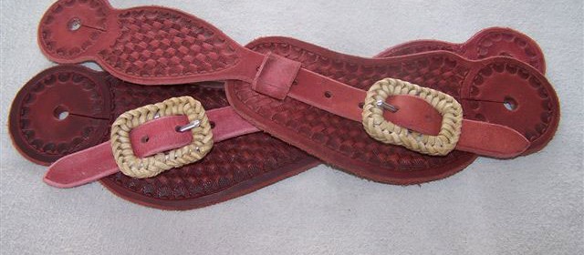 Spur straps with rawhide covered buckles